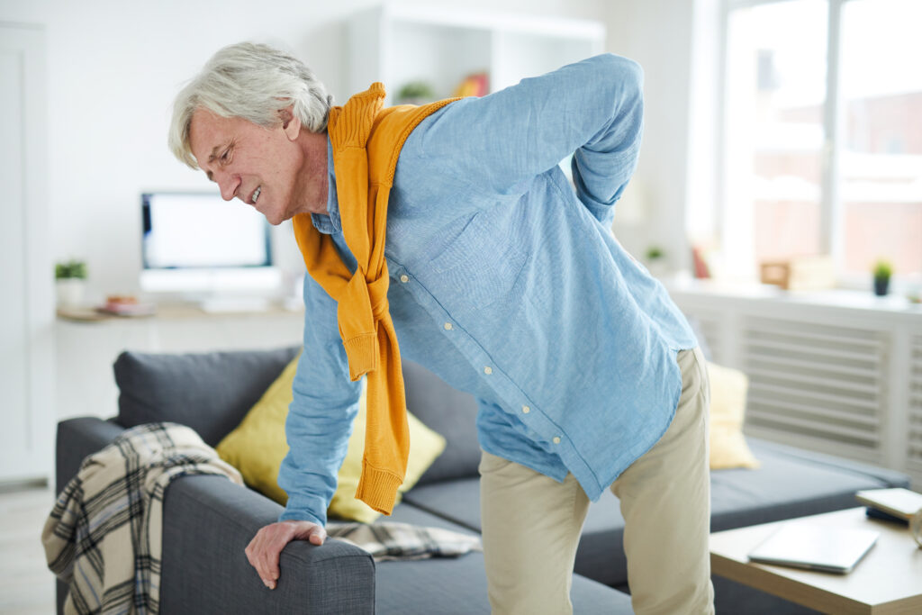 older-man-back-pain-holding-lower-back